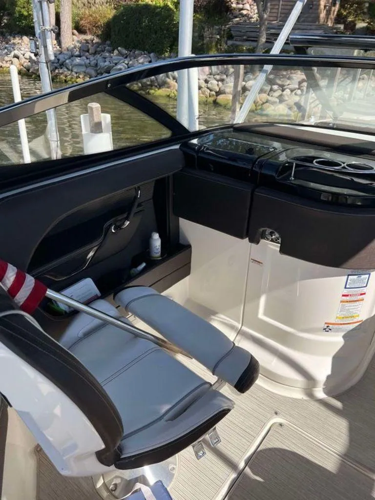 Slide: The Image of Interior of 2017 Sea Ray SLX 280 boat with seating and control panel. - 4