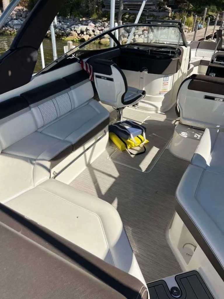 Slide: The Image of 2017 Sea Ray SLX 280 boat interior with seating and life jackets. - 8