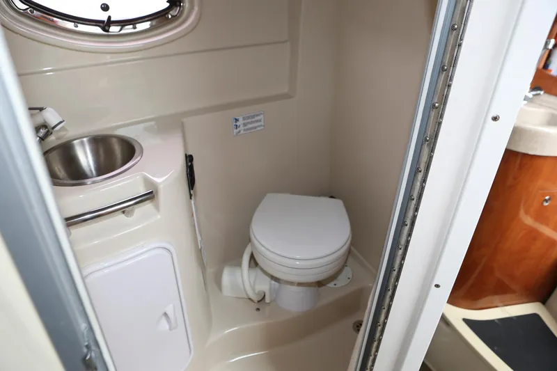 Slide: The Image of 2007 Four Winns 278 Vista boat bathroom with sink and toilet. - 15