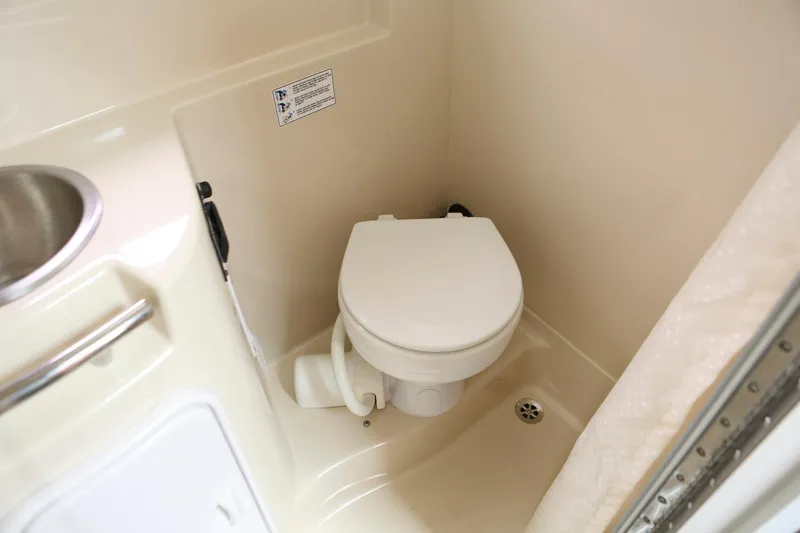 Slide: The Image of 2007 Four Winns 278 Vista boat bathroom with toilet and sink. - 16
