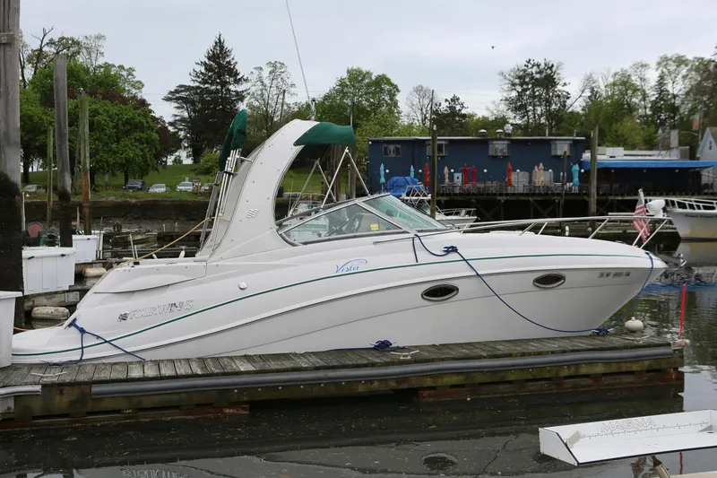 Slide: The Image of 2007 Four Winns 278 Vista boat docked at a marina. - 2