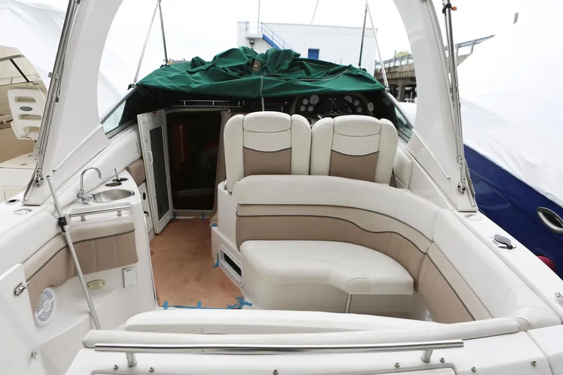 Slide: The Image of 2007 Four Winns 278 Vista boat interior with white seating and covered dashboard. - 3