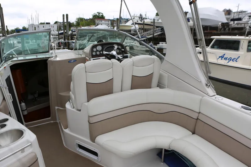 Slide: The Image of 2007 Four Winns 278 Vista boat interior with beige seating and steering console. - 4