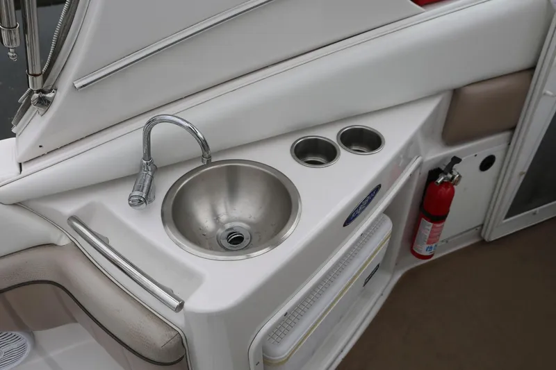 Slide: The Image of 2007 Four Winns 278 Vista boat sink area with faucet and fire extinguisher. - 8
