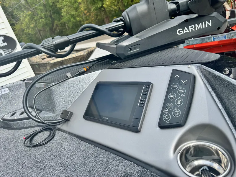 Slide: The Image of 2025 Ranger 621FS boat dashboard with Garmin navigation system and control panel. - 7