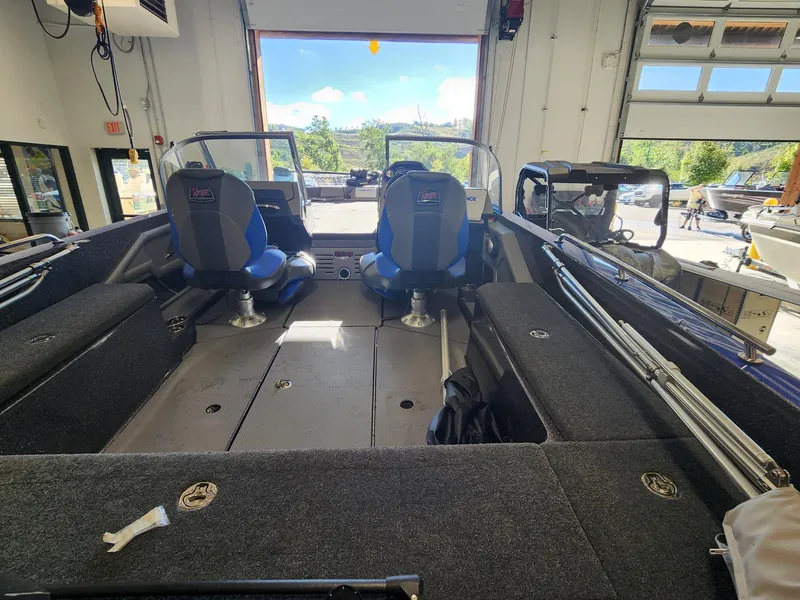 Slide: The Image of 2024 Ranger 620FS Ranger Cup Equipped boat interior with seating and storage compartments. - 2