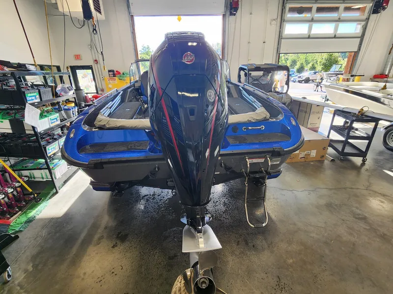 Slide: The Image of 2024 Ranger 620FS Ranger Cup Equipped boat in a garage, rear view. - 3