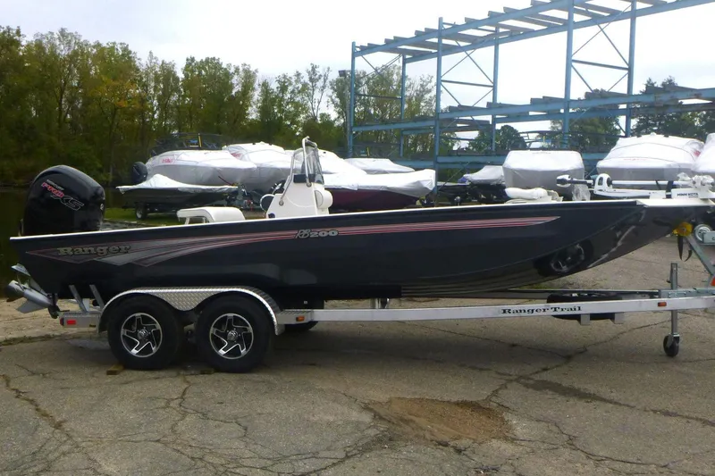The Image of 2024 Ranger RB200 boat on trailer in indoor showroom. - 0