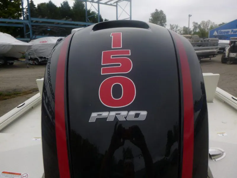 Slide: The Image of 2024 Ranger RB200 boat displayed indoors alongside another boat, under a pontoon banner. - 1