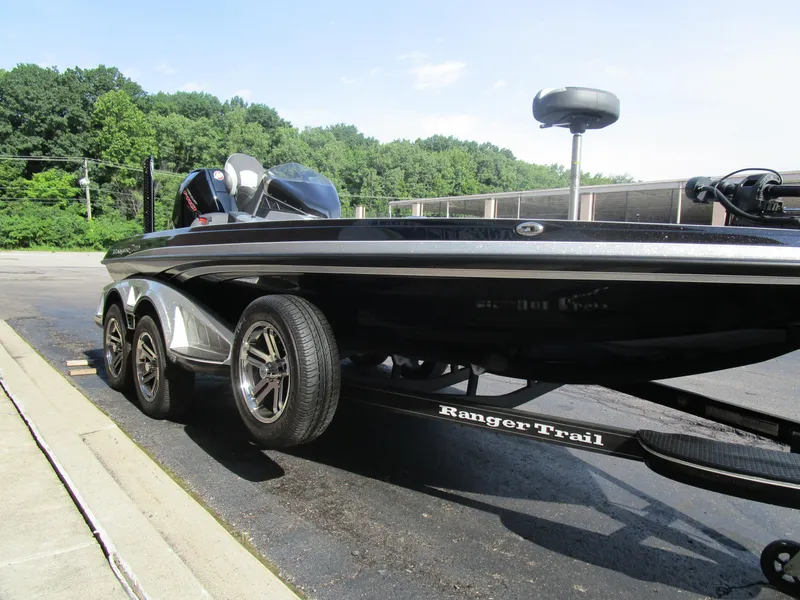 Slide: The Image of 2024 Ranger Z519 Ranger Cup Equipped boat on trailer, parked outdoors. - 3