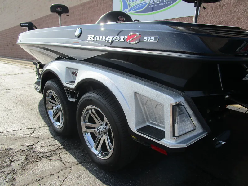 Slide: The Image of 2024 Ranger Z519 Ranger Cup Equipped boat on trailer, showcasing sleek design and chrome wheels. - 4