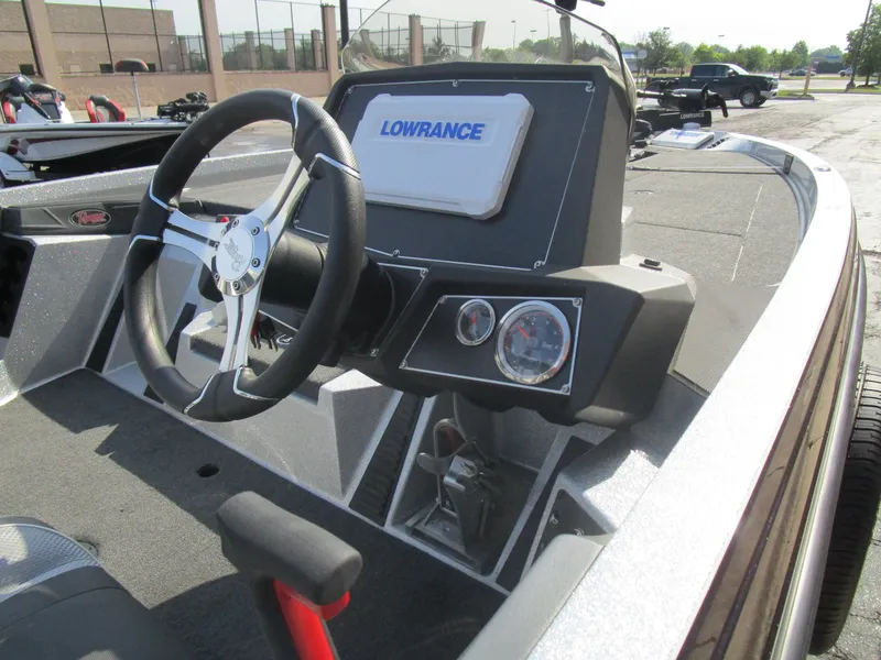 Slide: The Image of 2024 Ranger Z519 Ranger Cup boat dashboard with steering wheel and Lowrance display. - 5