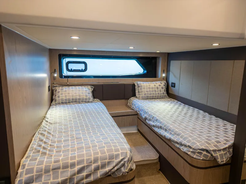 Slide: The Image of Luxurious cabin interior of 2020 Azimut Atlantis 45 yacht with twin beds. - 24