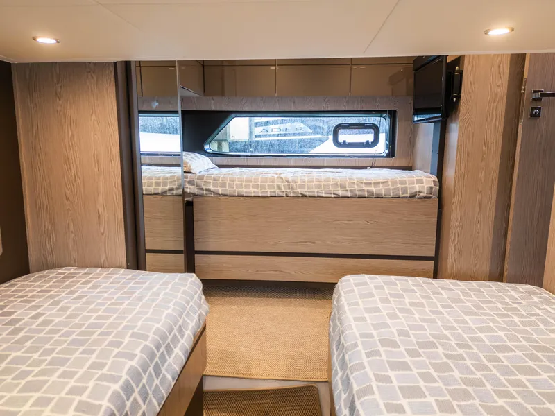 Slide: The Image of Interior of 2020 Azimut Atlantis 45 yacht with twin beds and modern design. - 25