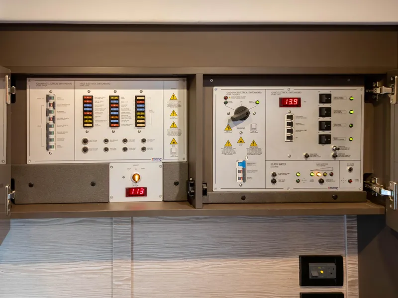 Slide: The Image of Electrical control panel of 2020 Azimut Atlantis 45 yacht, featuring various switches and indicators. - 27