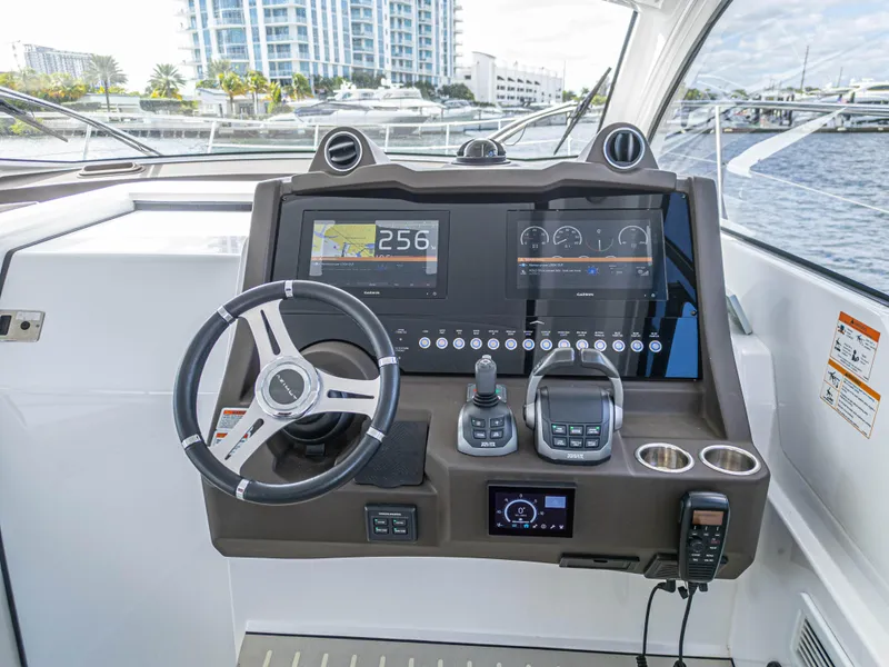 Slide: The Image of Azimut Atlantis 45 yacht helm, featuring modern navigation controls and dual displays, 2020 model. - 33