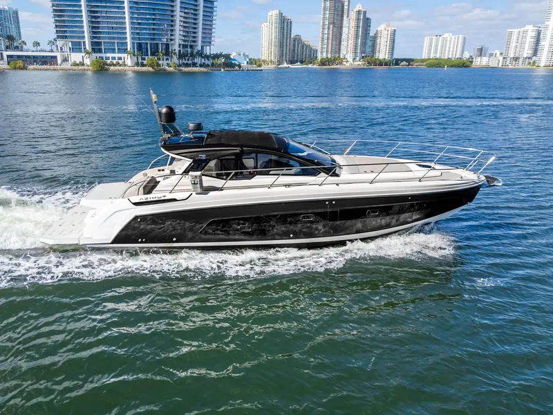 Slide: The Image of 2020 Azimut Atlantis 45 yacht cruising in a city waterfront setting. - 4