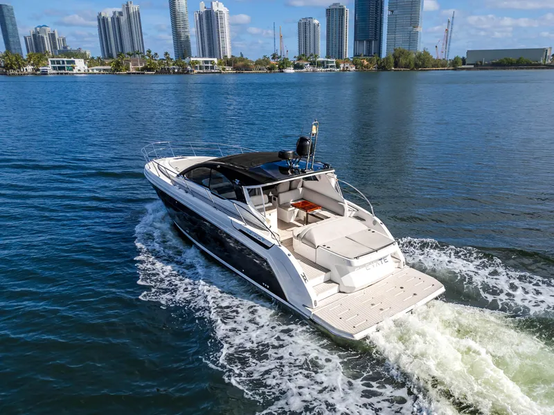 Slide: The Image of 2020 Azimut Atlantis 45 yacht cruising in a city waterfront setting. - 5