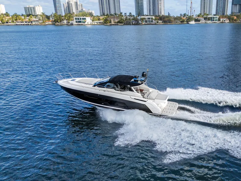 Slide: The Image of 2020 Azimut Atlantis 45 yacht cruising on a sunny day in a city waterfront. - 6