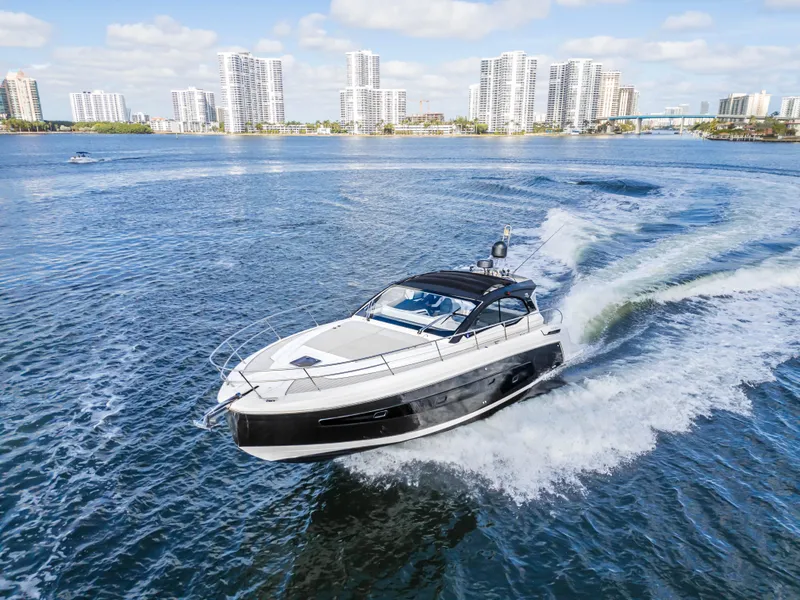 Slide: The Image of 2020 Azimut Atlantis 45 yacht cruising in a city waterfront setting. - 9