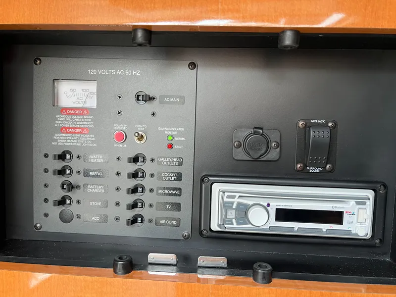 Slide: The Image of Control panel of a 2007 Chaparral Signature 250 boat with switches and stereo system. - 10