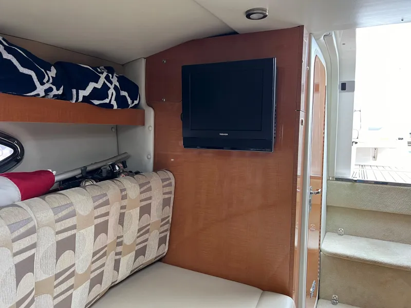 Slide: The Image of Interior of 2007 Chaparral Signature 250 boat with TV and seating area. - 12