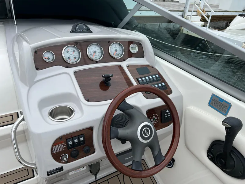 Slide: The Image of 2007 Chaparral Signature 250 boat dashboard with steering wheel and control panel. - 4