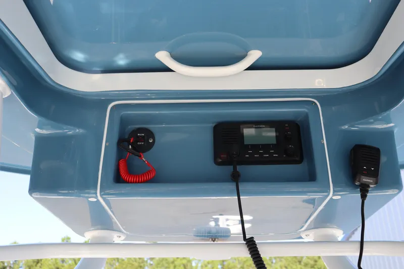 Slide: The Image of 2025 Yellowfin 26 Hybrid boat console with radio and controls. - 20