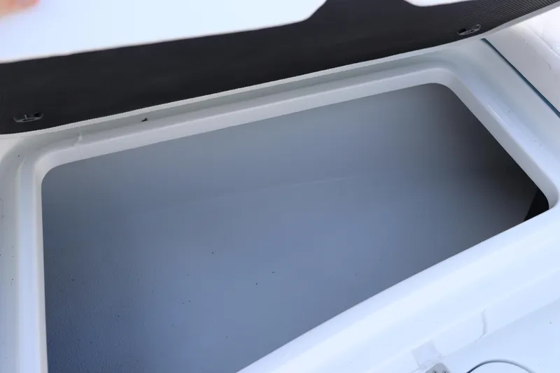 Slide: The Image of Open storage compartment on 2025 Yellowfin 26 Hybrid boat. - 22