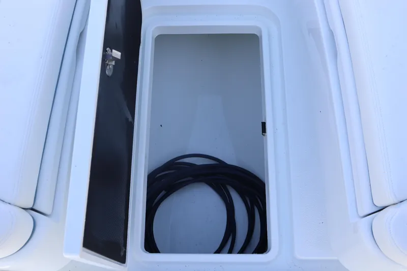 Slide: The Image of Open storage compartment on 2025 Yellowfin 26 Hybrid boat. - 24