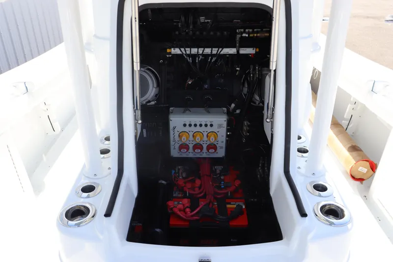 Slide: The Image of 2025 Yellowfin 26 Hybrid boat engine compartment with control panel and wiring. - 25