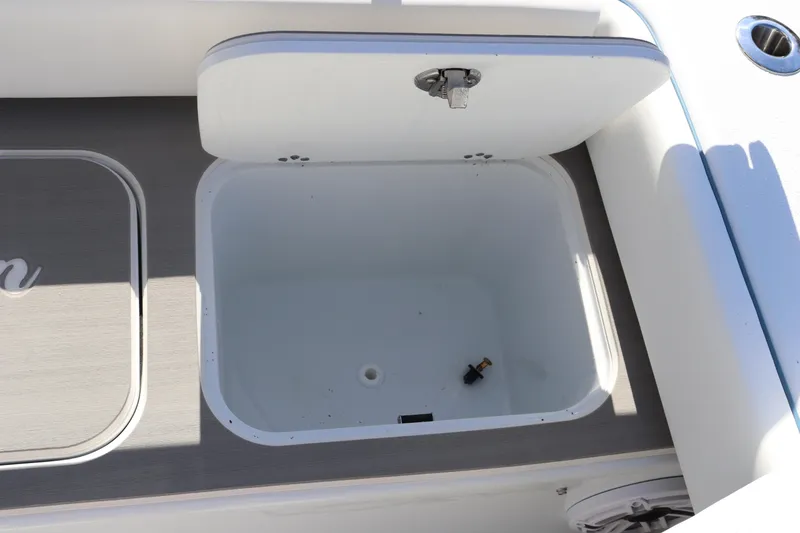 Slide: The Image of Open storage compartment on 2025 Yellowfin 26 Hybrid boat. - 32
