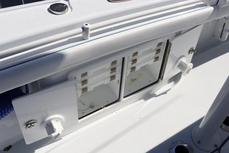 Slide: The Image of 2025 Yellowfin 26 Hybrid boat deck with storage compartments. - 35