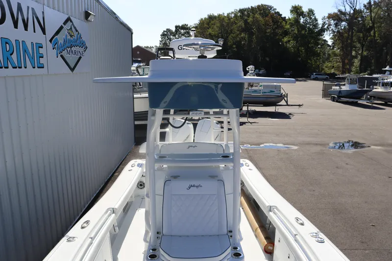 Slide: The Image of 2025 Yellowfin 26 Hybrid boat at marina, showcasing sleek design and modern features. - 9