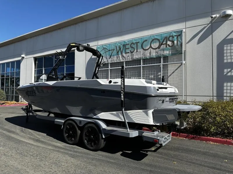 Slide: The Image of 2025 Axis A245 boat on trailer outside West Coast dealership. - 3