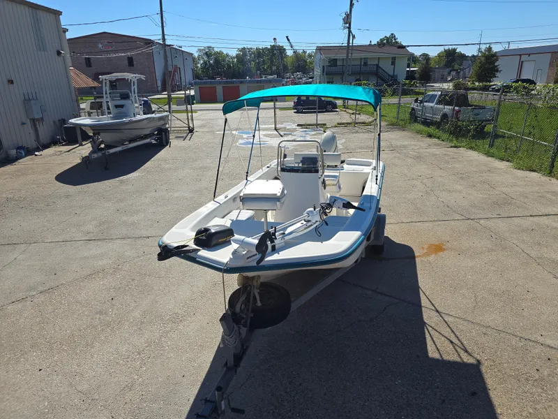 Slide: The Image of 2007 Sundance B18CC boat with canopy on trailer in sunny outdoor setting. - 5