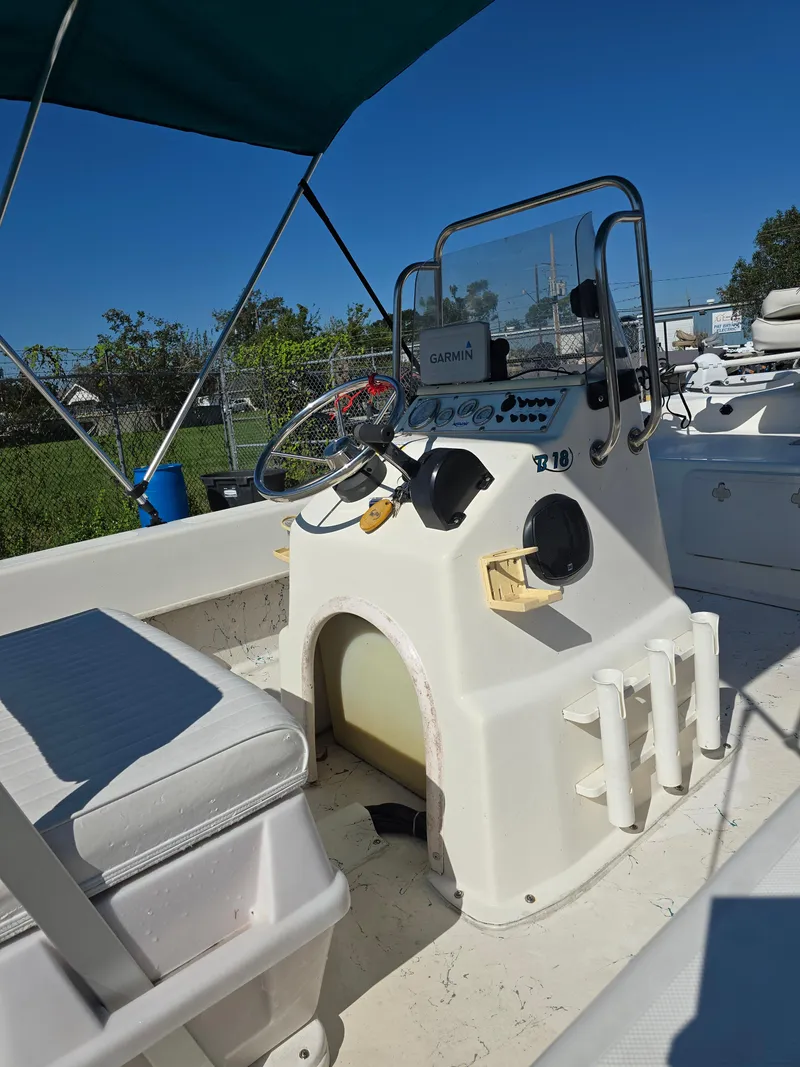 Slide: The Image of 2007 Sundance B18CC boat interior with steering console and seating. - 7