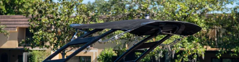 Slide: The Image of 2025 Regal LS2 Surf boat interior with sleek white seating and modern design. - 15