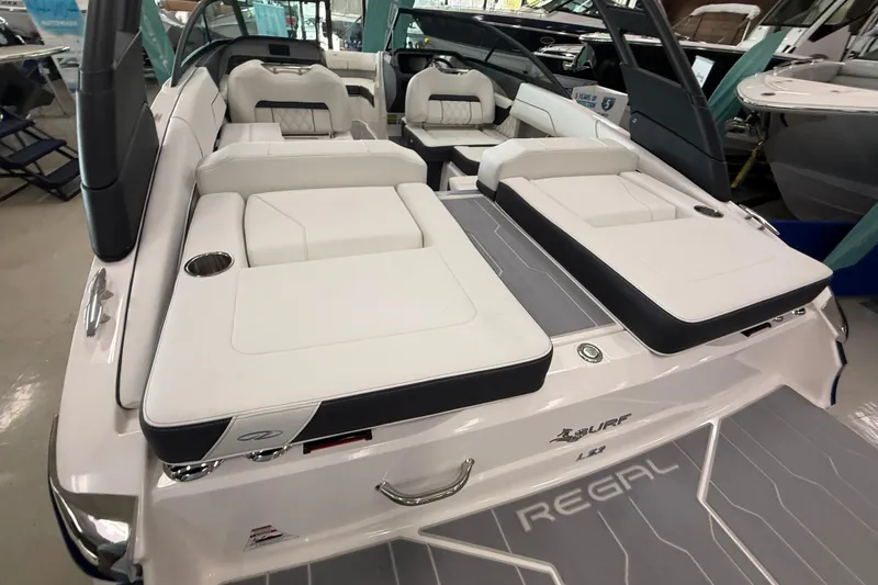 Slide: The Image of 2025 Regal LS2 Surf boat interior with luxurious white seating and modern design. - 16