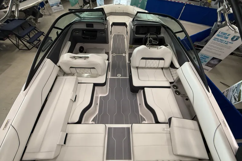Slide: The Image of 2025 Regal LS2 Surf boat interior with luxurious white seating and modern design. - 19
