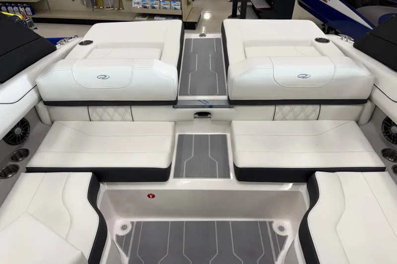 Slide: The Image of 2025 Regal LS2 Surf boat interior with white cushioned seating and modern design. - 20