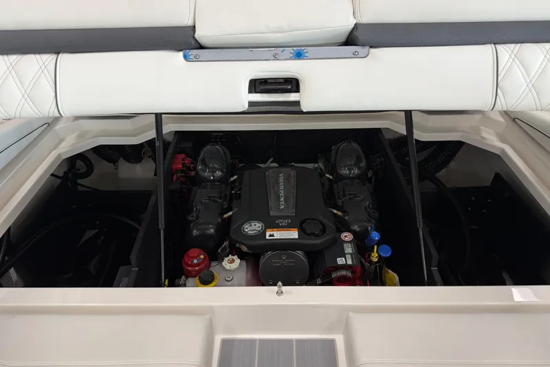 Slide: The Image of 2025 Regal LS2 Surf boat engine compartment with Volvo Penta engine. - 23