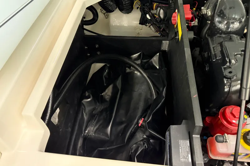 Slide: The Image of 2025 Regal LS2 Surf engine compartment with visible components and wiring. - 24