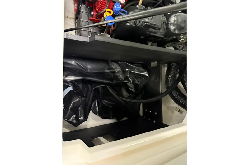Slide: The Image of Engine compartment of 2025 Regal LS2 Surf boat, showcasing components and wiring. - 27