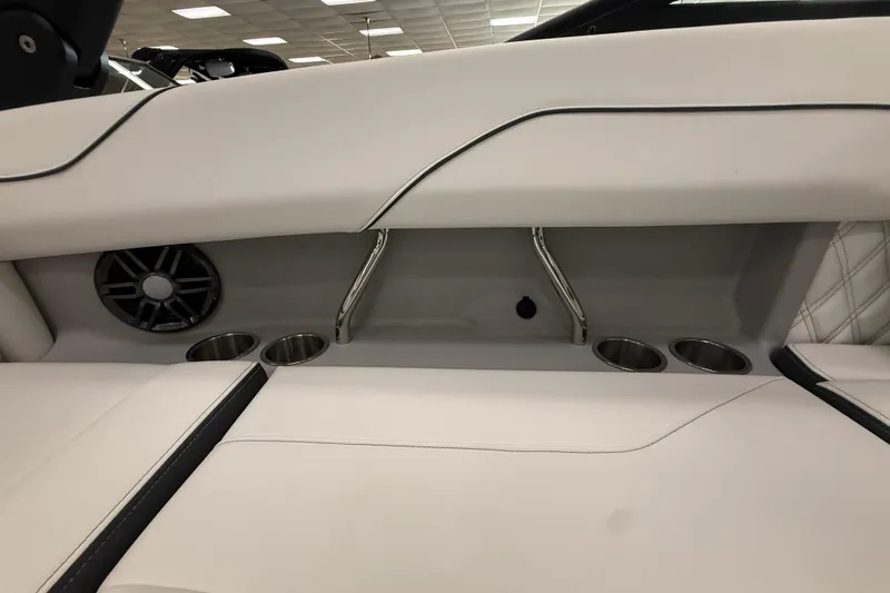Slide: The Image of 2025 Regal LS2 Surf boat interior with cup holders and speaker. - 30