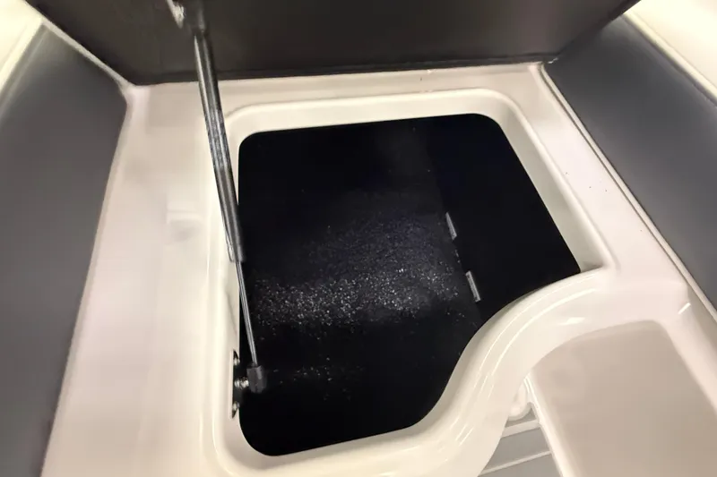 Slide: The Image of Open storage compartment in 2025 Regal LS2 Surf boat. - 32