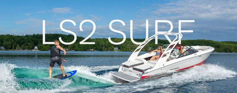 Slide: The Image of 2025 Regal LS2 Surf boat rear view in showroom, showcasing propeller and swim platform. - 4