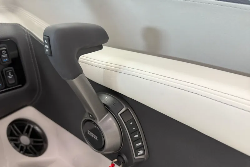 Slide: The Image of 2025 Regal LS2 Surf boat throttle control with trim and cruise buttons. - 44