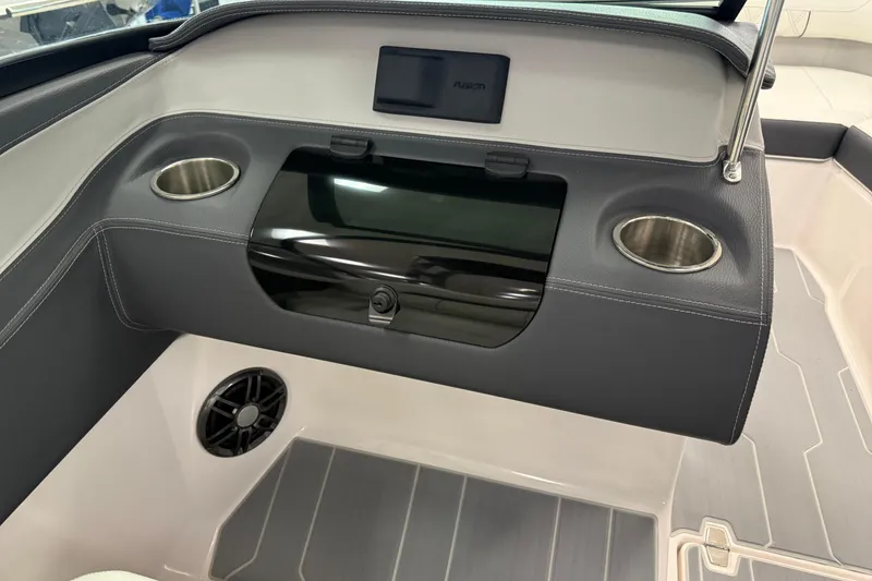 Slide: The Image of 2025 Regal LS2 Surf boat interior with cup holders and speaker. - 45