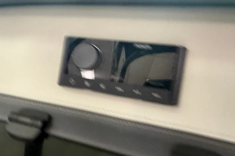 Slide: The Image of Control panel of 2025 Regal LS2 Surf boat, featuring a sleek design. - 46